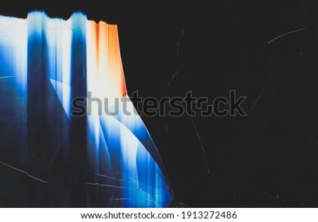 Damaged screen background. Blur colorful glitch. Black shattered TV display matrix glass texture with dust scratches defocused orange blue white prism art poster with copy space.