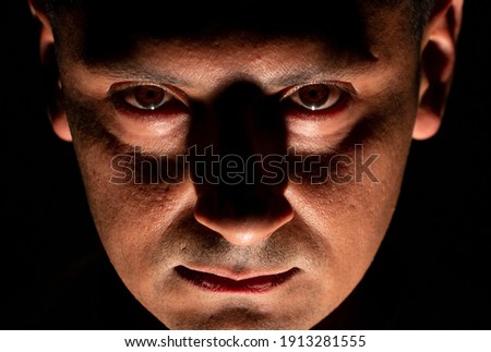 terrifying image of man in shadows