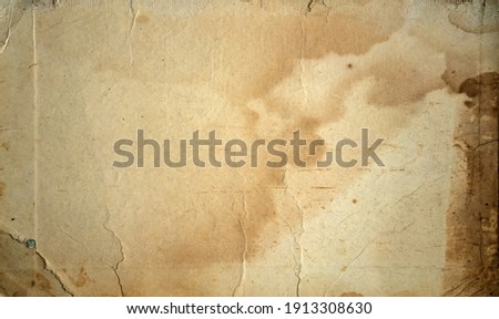 The texture of old yellowed cardboard with spots. Royalty-Free Stock Photo #1913308630