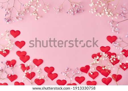 Red hearts and flowers background, romantic concept, top view. Valentines Day greeting card concept. Mothers Day anniversary design.