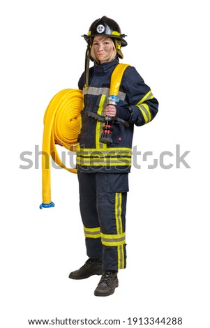 Full body young brave woman in uniform and hardhat of fireman with fire hose on shoulders looking at camera isolated on white background. 