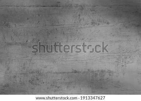 gray background. in the photo, a gray wooden wall of an old building, close-up