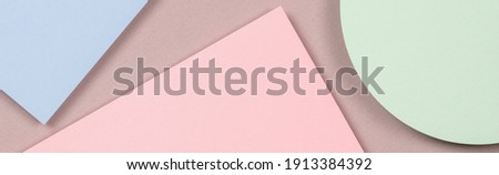 Abstract colored paper texture background. Geometric shapes and lines in light blue, green, pastel pink colors