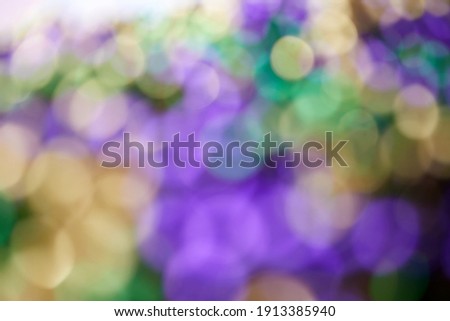 Colorful blurred background with bokhe effect for Mardi gras. Real photo.