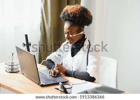 African female doctor consulting patient make online webcam video call on laptop. Black woman therapist videoconferencing in remote computer healthcare telemedicine virtual chat. Telehealth videocall. Royalty-Free Stock Photo #1913386366