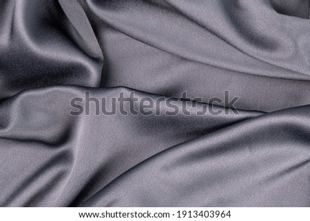 wavy rippled gray blue purple silk satin fabric abstract background
