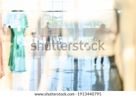Empty blurry mall background. Defocused wallpaper. Business office interior. Light lifestyle supermarket. Bokeh effect. Holiday backdrop. Copyspace for text. Ready for card or site design