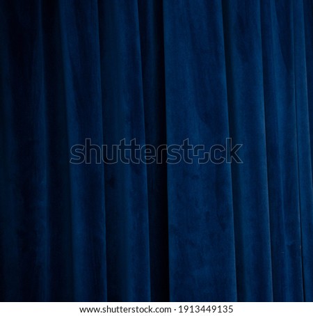 
Blue fabric background. Curtain abstraction