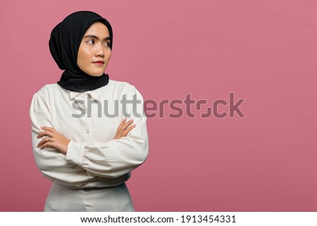 Portrait of beautiful Asian woman wearing a white shirt with folded hand
