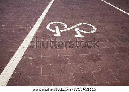 Bicycle path sign on asphalt, direction sign for bicycles. Traffic Laws.