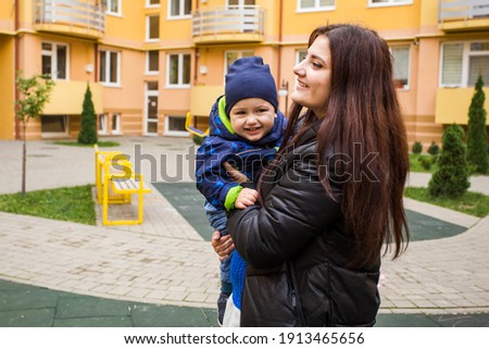 Mother with toddler boy at playground