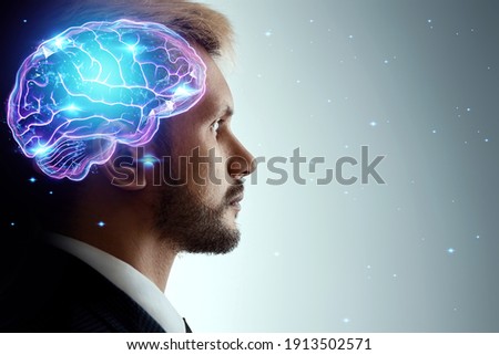 Close up portrait of a man from the side in profile and a hologram of a working brain. The concept of intelligence, brain work, thought process Royalty-Free Stock Photo #1913502571
