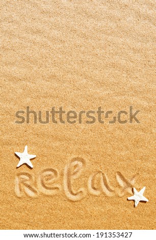 Word relax and seashells on the sand