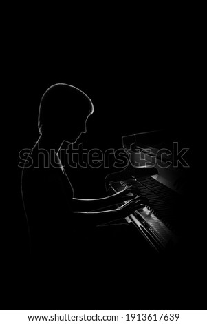 Piano player. Pianist woman playing grand piano classical music concert