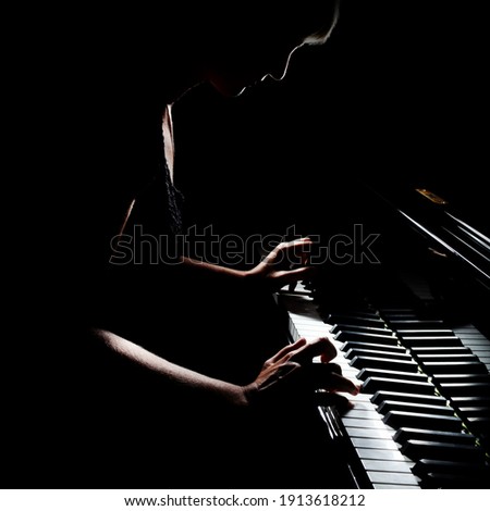 Piano player. Pianist playing grand piano musical instrument