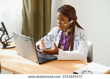 African female doctor consulting patient make online webcam video call on laptop. Black woman therapist videoconferencing in remote computer healthcare telemedicine virtual chat. Telehealth videocall. Royalty-Free Stock Photo #1913644573