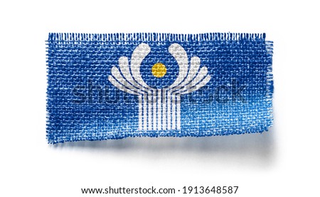 CIS flag on a piece of cloth on a white background