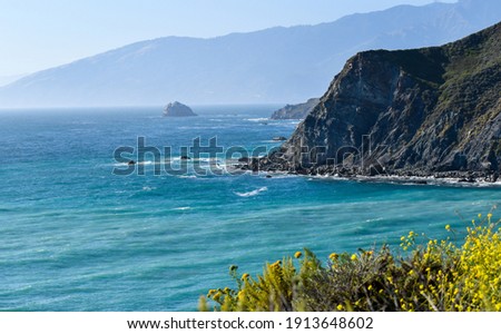 Big Sur California Coast cliffs with beautiful aquamarine waters 