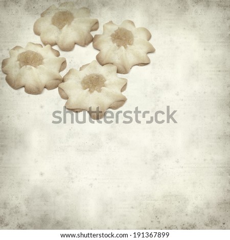 textured old paper background with shortbread biscuits