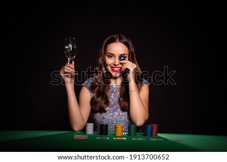 Photo of lady sit poker table hold glass champagne chip cover eye wear glossy dress isolated black color background