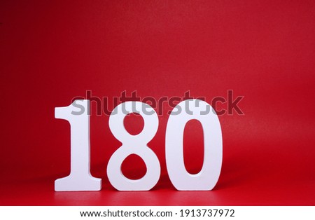Number 180 ( one eight zero ) on red Background with Copy Space - 180% Percentage or Promotion - Discount or anniversary concept - Angle Degree                               