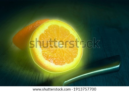 orange fruit yellow neon on background blu