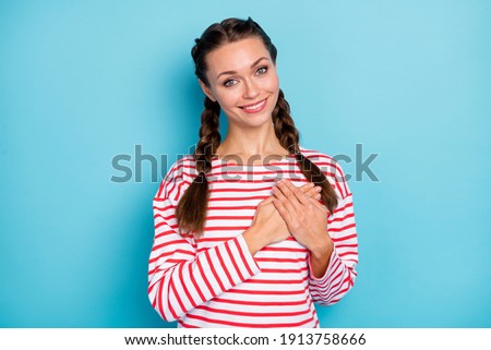 Photo of sweet calm young lady wear red shirt two arms heart chest isolated pastel blue color background
