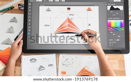 Graphic designer drawing sketches logo design. The concept of a new brand. Professional creative occupation with idea. Royalty-Free Stock Photo #1913769178