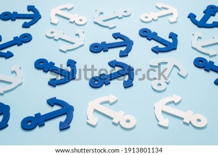 Blue anchors on a blue background. Pattern. 