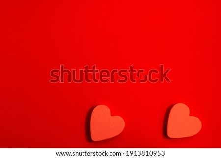 pattern of red hearts on a red background with bright light. creative idea with heart. love concept