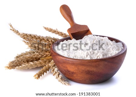 flour with wheat in a wooden bowl and shovel on a white background Royalty-Free Stock Photo #191383001