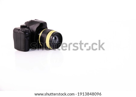Toy camera on a white background. Concept. Copy space