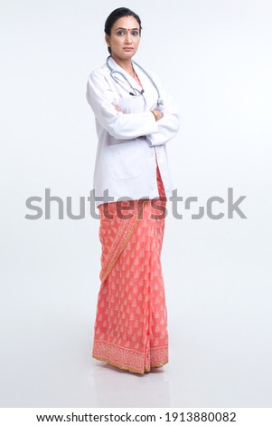 Portrait of confident female doctor with arms crossed.
