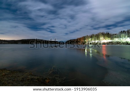 Landscape of half frozen Vlasina lake in cold winter night. Long exposure photo.