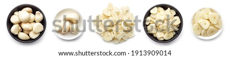 Set of whole and chopped garlic cloves and slices isolated on white background, top view Royalty-Free Stock Photo #1913909014