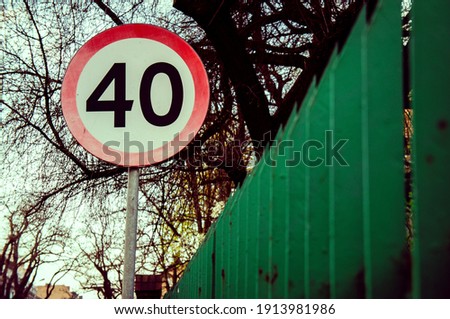 A speed limit sign outdoors