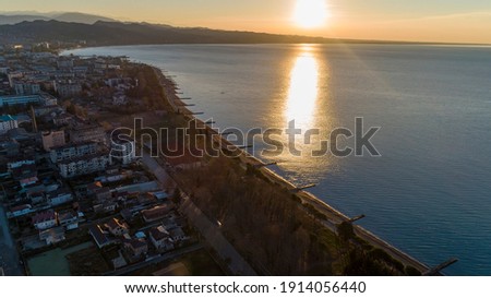 Dawn over the black sea. resort town Sukhum, Abkhazia aerial. Beach