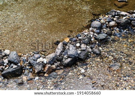 Small streams, clear water until many rocks can be seen.