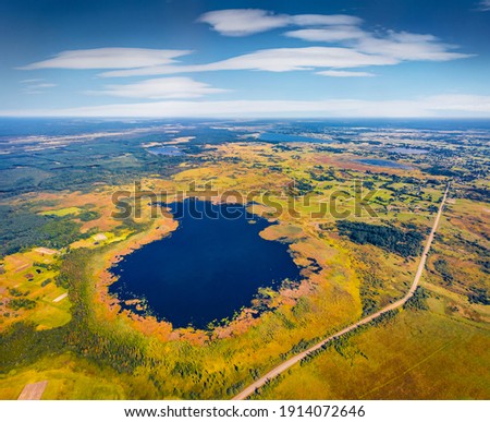 Aerial landscape photography. Aerial view in the shape of heart of Bile Lake. Attractive morning scene of Shatsky National Park, Volyn region, Ukraine, Europe. Beauty of nature concept background. 