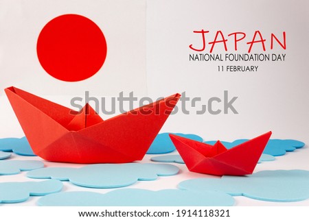 Japan National Foundation Day. 11 February. Japan flag with two red origami boat. Royalty-Free Stock Photo #1914118321