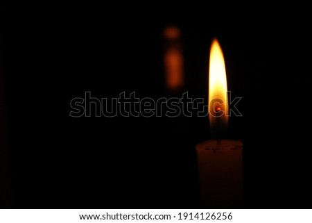 candle flame at dark night
