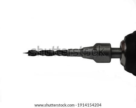 Furniture drill on a white background. Drilling and repair. Drill clamp.