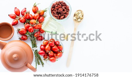  herbal tea Dog rose, bunch branch Rosehips Rosa canina hips, goji berries and sea buckthorn  - Medicinal plants herbs composition to enhance immunity and vitamins