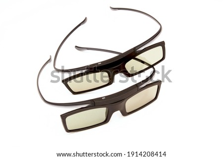 Two pairs of 3D glasses isolated on a white background
