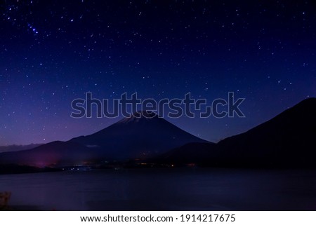 Mt. Fuji and starry sky at midnight Royalty-Free Stock Photo #1914217675