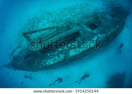 Divers on a wreck at the bridge dive site off the island of St Martin, Dutch Caribbean Royalty-Free Stock Photo #1914250144