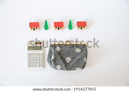 Houses, purse, and calculator, money image related to housing
