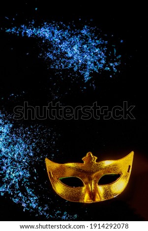Yellow carnival mask for masquerade. Jewish holiday Purim.