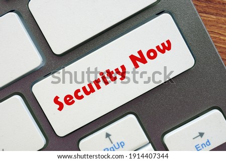  Security Now sign on the piece of paper.
