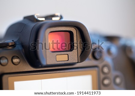 Part of a professional digital camera. Macro photo of a camera viewfinder.